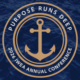 Circular navy and gold seal with an anchor in the center and the text 'Purpose Runs Deep' and '2026 IWEA Annual Conference' around the edge